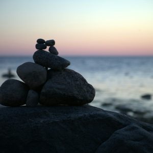 a stack of rocks sitting on top of a beach